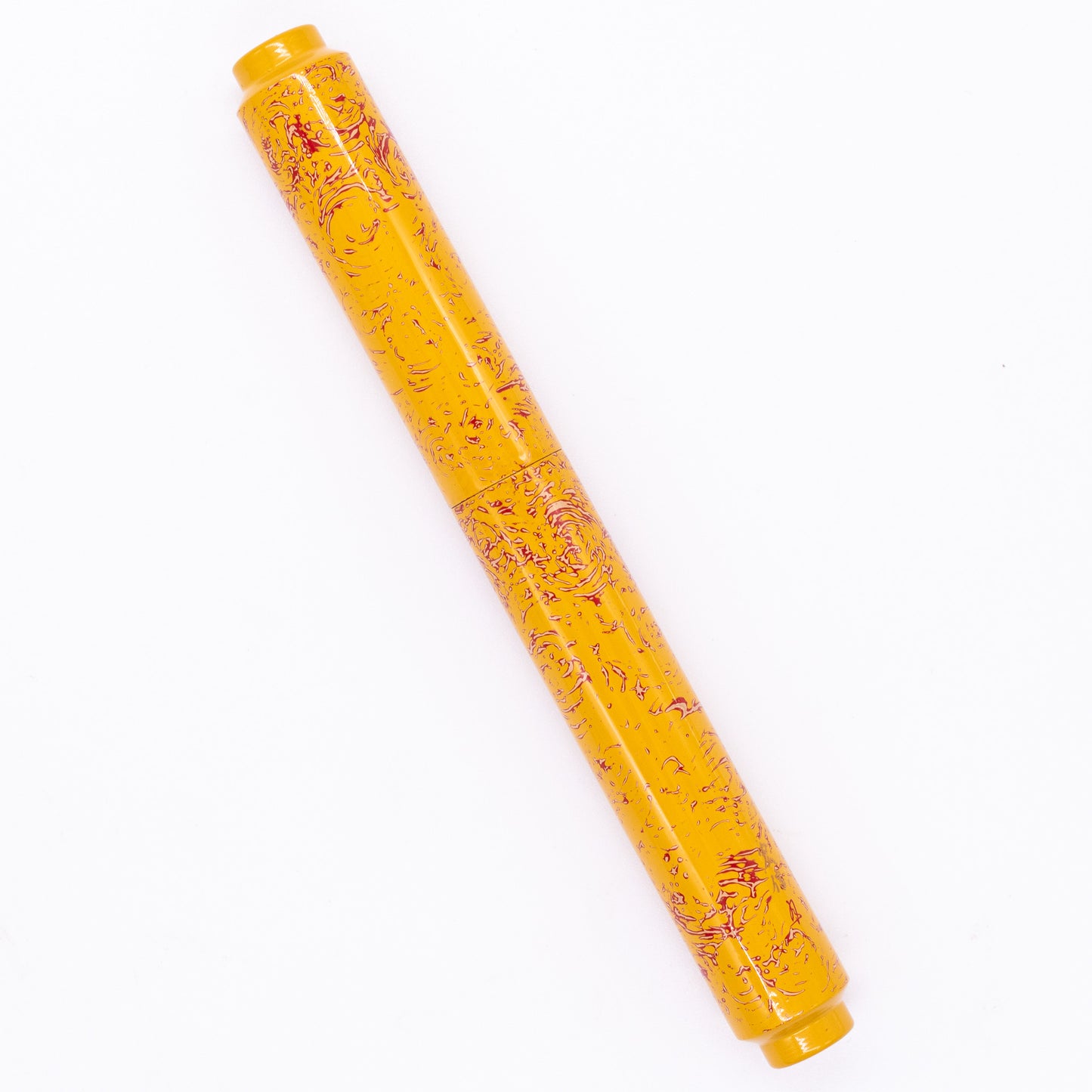 An overhead view of the AP Limited Editions Urushi Lacquer Art Fountain Pen - Sunshine capped, angled towards the left.