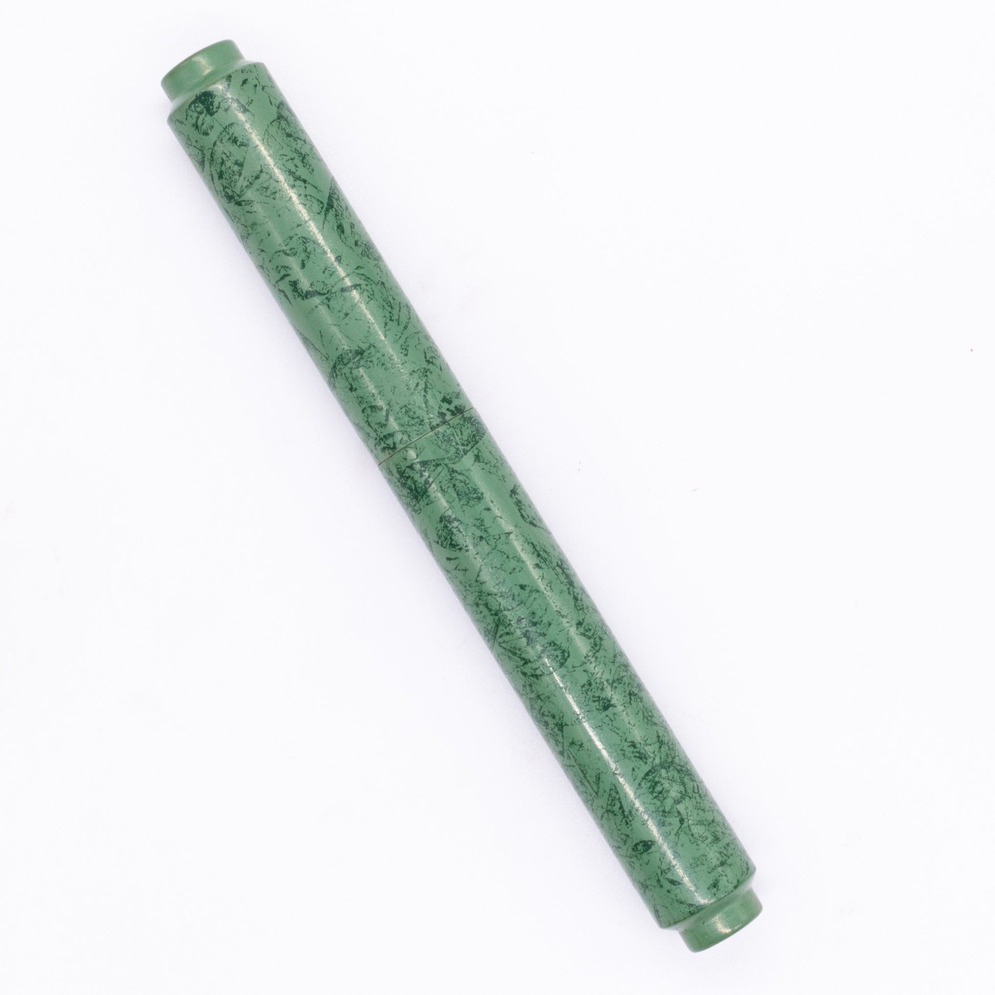 An overhead view of the AP Limited Editions Urushi Lacquer Art Fountain Pen - Celadon Moss capped, angled towards the left.