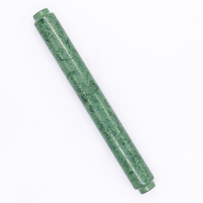 An overhead view of the AP Limited Editions Urushi Lacquer Art Fountain Pen - Celadon Moss capped, angled towards the left.
