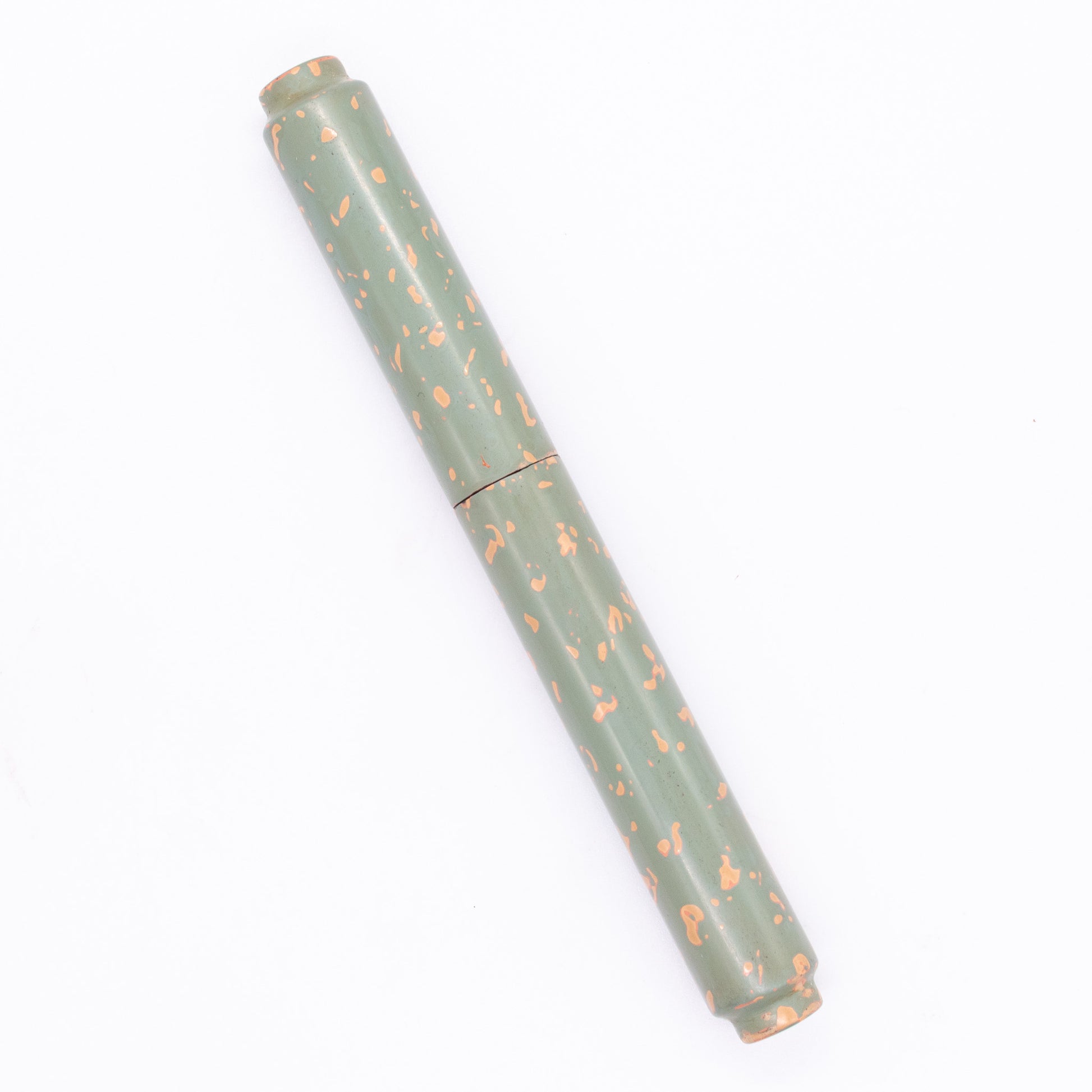 An overhead view of the AP Limited Editions Urushi Lacquer Art Fountain Pen - Garden Stone capped, angled towards the left.