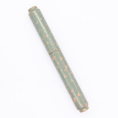 An overhead view of the AP Limited Editions Urushi Lacquer Art Fountain Pen - Garden Stone capped, angled towards the left.