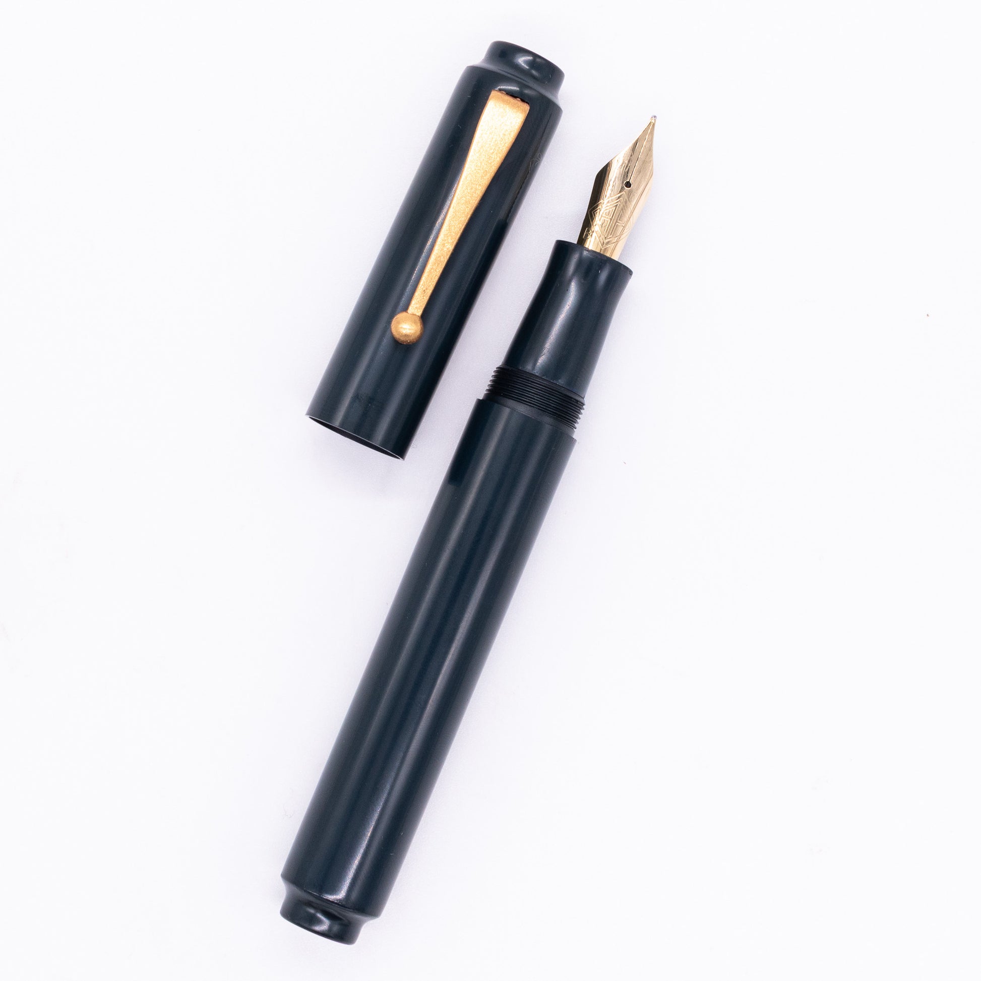 An overhead view of the AP Limited Editions Urushi Lacquer Art Fountain Pen - Konkikyo uncapped, with the cap next to the body angled towards the right.