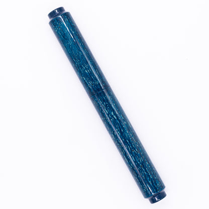 An overhead view of the AP Limited Editions Urushi Lacquer Art Fountain Pen - Midnight capped, angled towards the left.