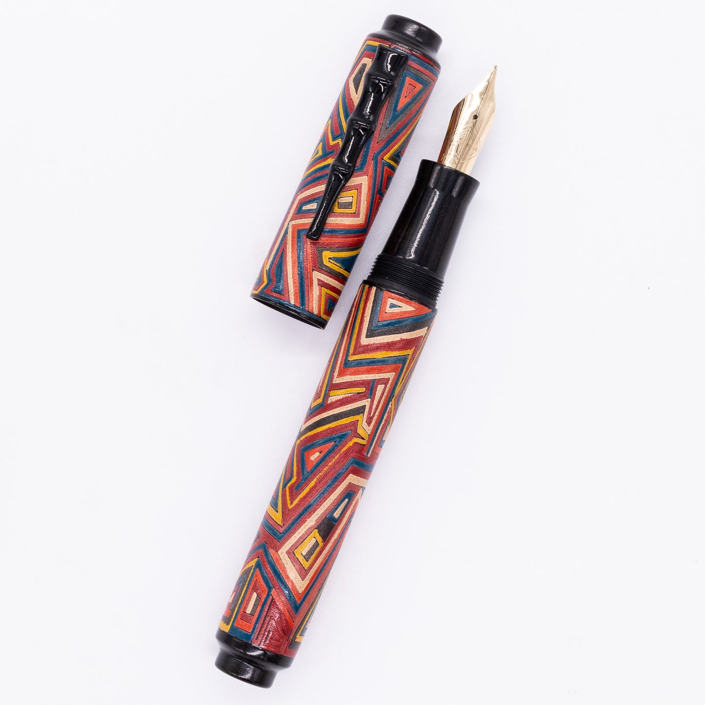 An overhead view of the AP Limited Editions Urushi Lacquer Art Fountain Pen - Pathways uncapped, with the cap next to the body angled towards the right.