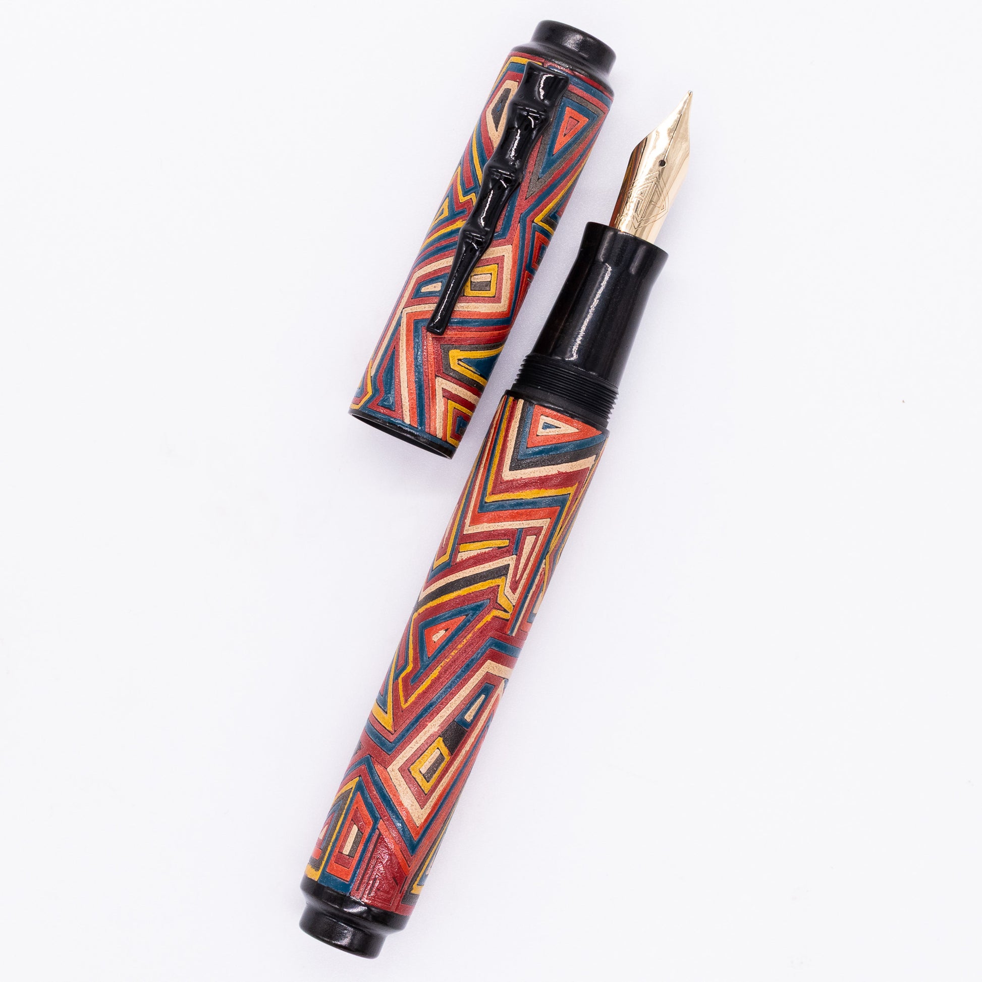 An overhead view of the AP Limited Editions Urushi Lacquer Art Fountain Pen - Pathways uncapped, with the cap next to the body angled towards the right.