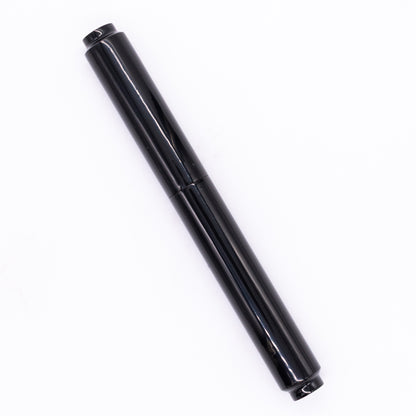 An overhead view of the AP Limited Editions Urushi Lacquer Art Fountain Pen - Roiro Black capped, angled towards the left.