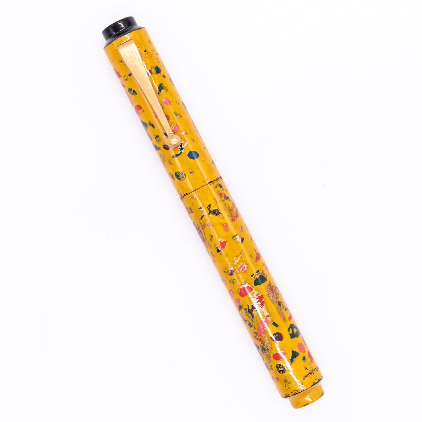 An overhead view of the AP Limited Editions Urushi Lacquer Art Fountain Pen - The Magical Urushi Yellow capped, angled towards the left.