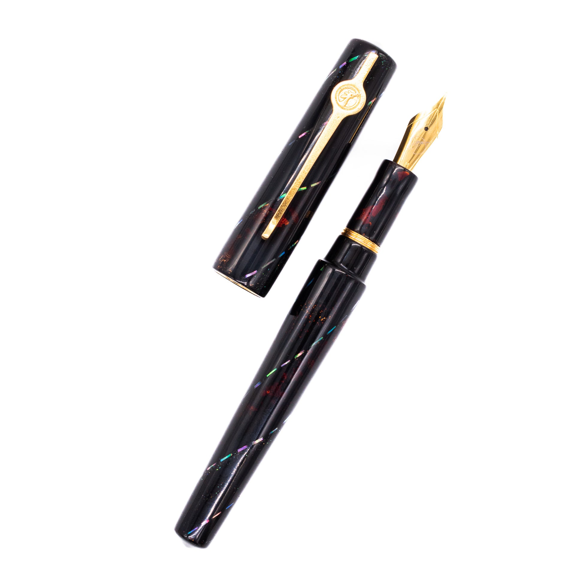 An overhead view of the ConCoPens Traditional Vietnamese Lacquer Fountain Pen - Aurora Scroll uncapped, with the cap next to the body angled towards the right.
