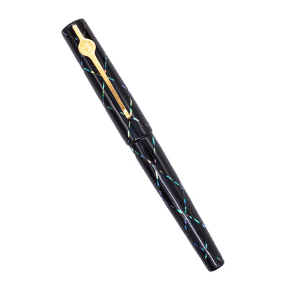 An overhead view of the ConCoPens Traditional Vietnamese Lacquer Fountain Pen - Aurora X capped, angled towards the left.