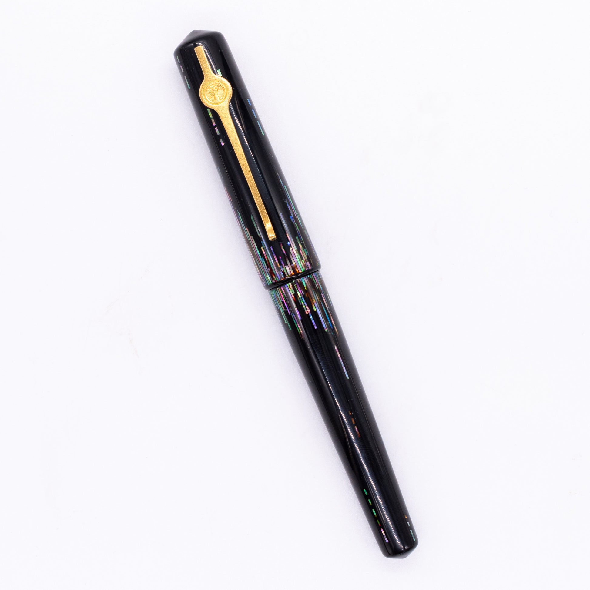 An overhead view of the ConCoPens Traditional Vietnamese Lacquer Fountain Pen - Aurora capped, angled towards the left.