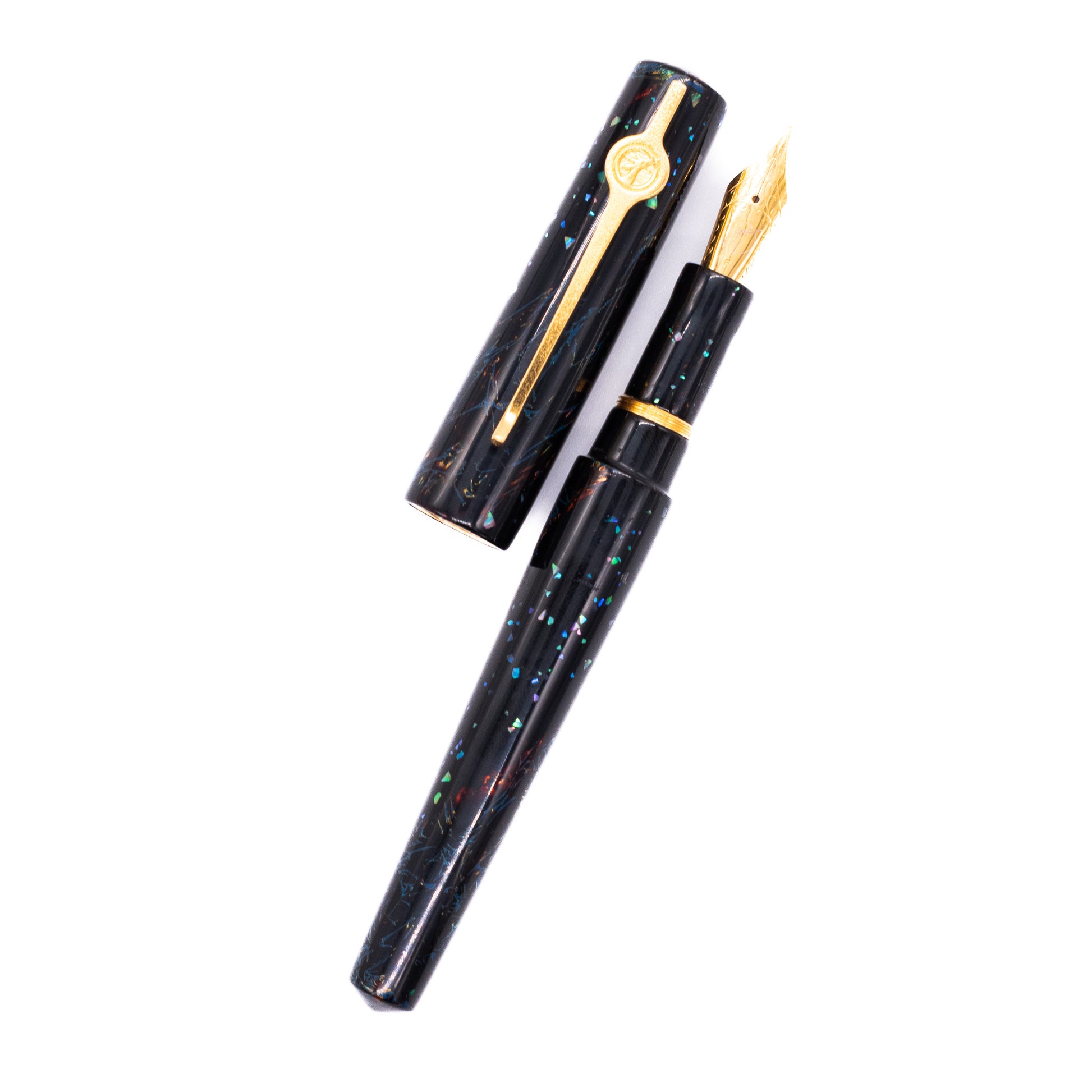 An overhead view of the ConCoPens Traditional Vietnamese Lacquer Fountain Pen - Obsidia uncapped, with the cap next to the body angled towards the right.