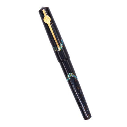 An overhead view of the ConCoPens Traditional Vietnamese Lacquer Fountain Pen - Ocean Serenade capped, angled towards the left.