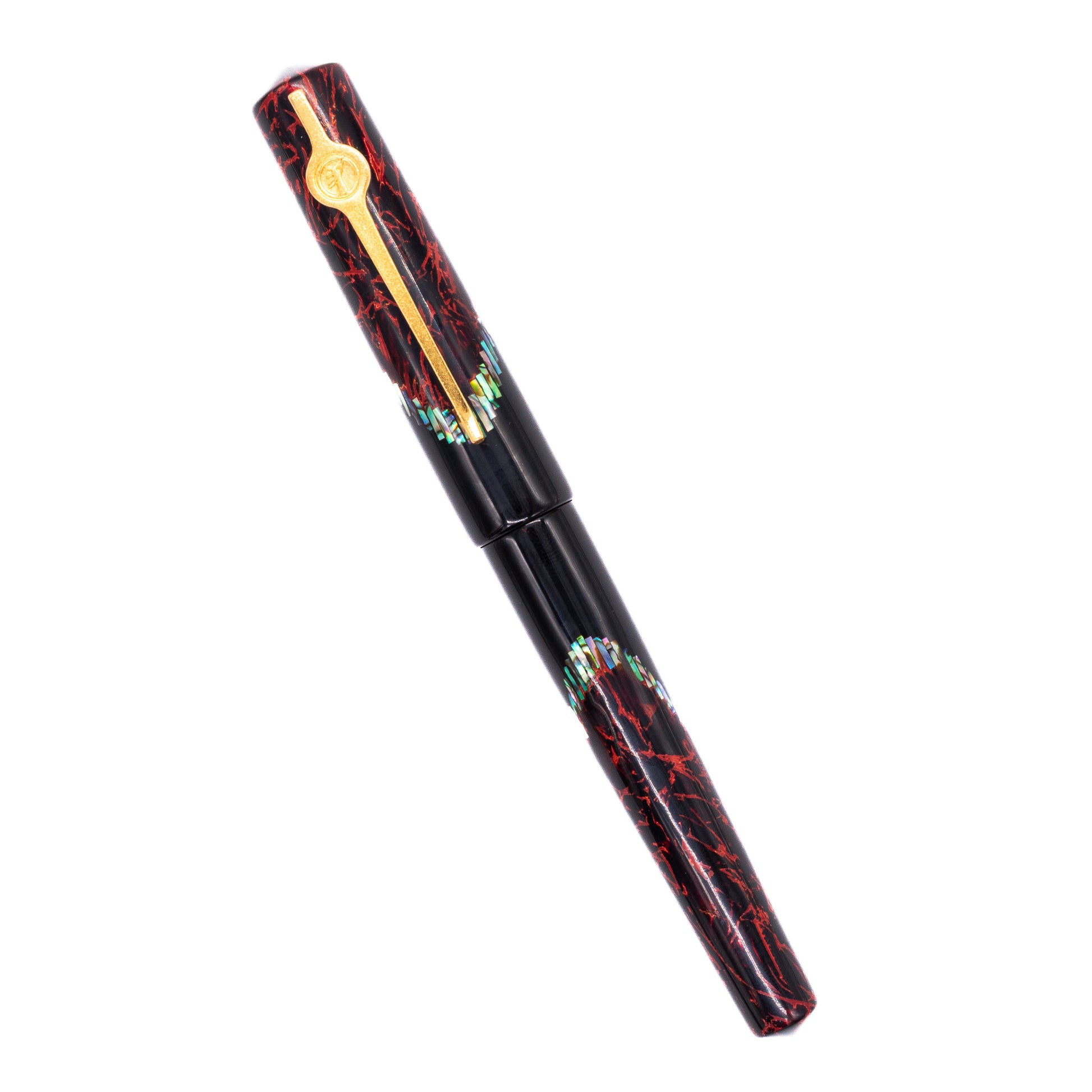 An overhead view of the ConCoPens Traditional Vietnamese Lacquer Fountain Pen - Pyre capped, angled towards the left.