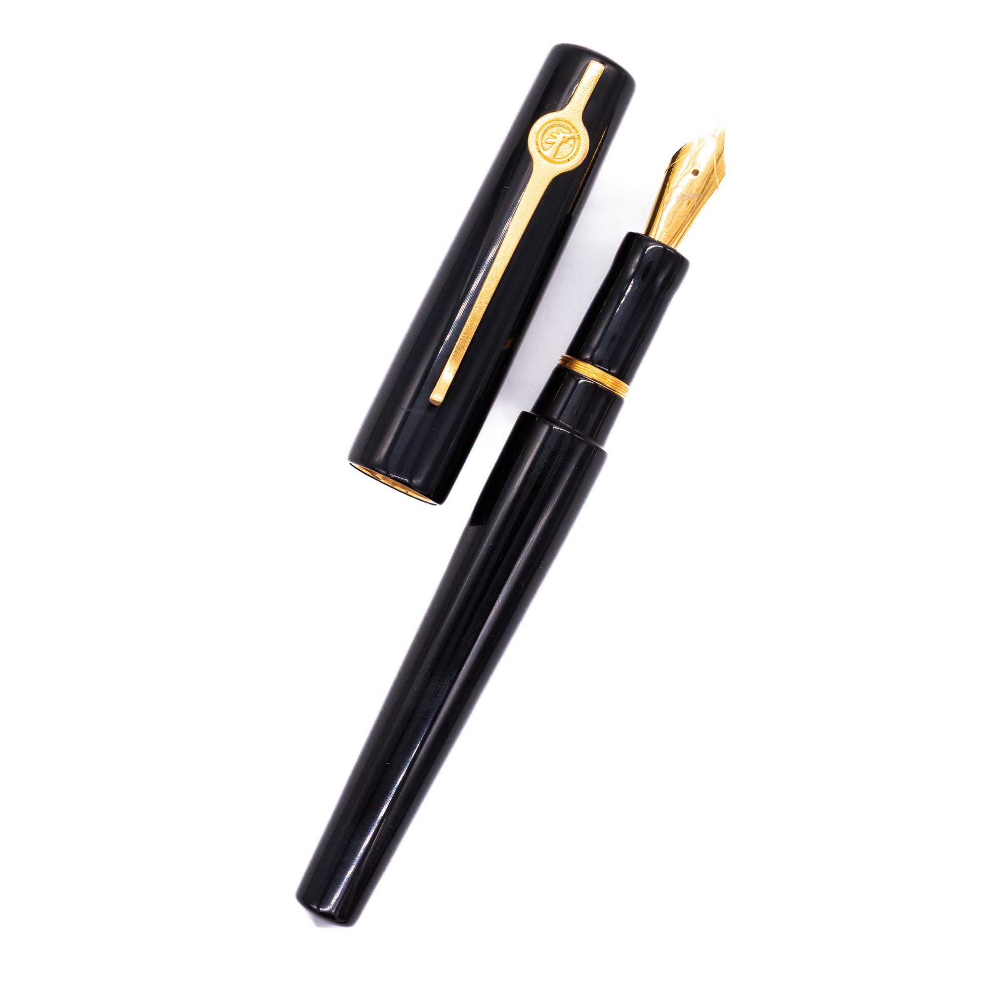 An overhead view of the ConCoPens Traditional Vietnamese Lacquer Fountain Pen - Then uncapped, with the cap next to the body angled towards the right.